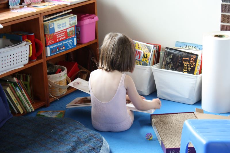 Reading to Serafina Buttercup (in basket)